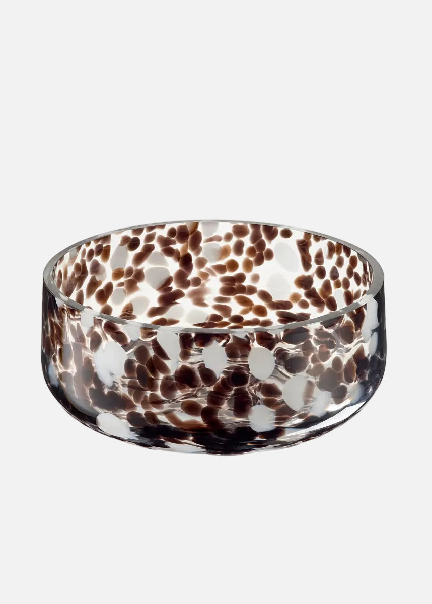 Glass bowl with brown and white speckled pattern on a white background