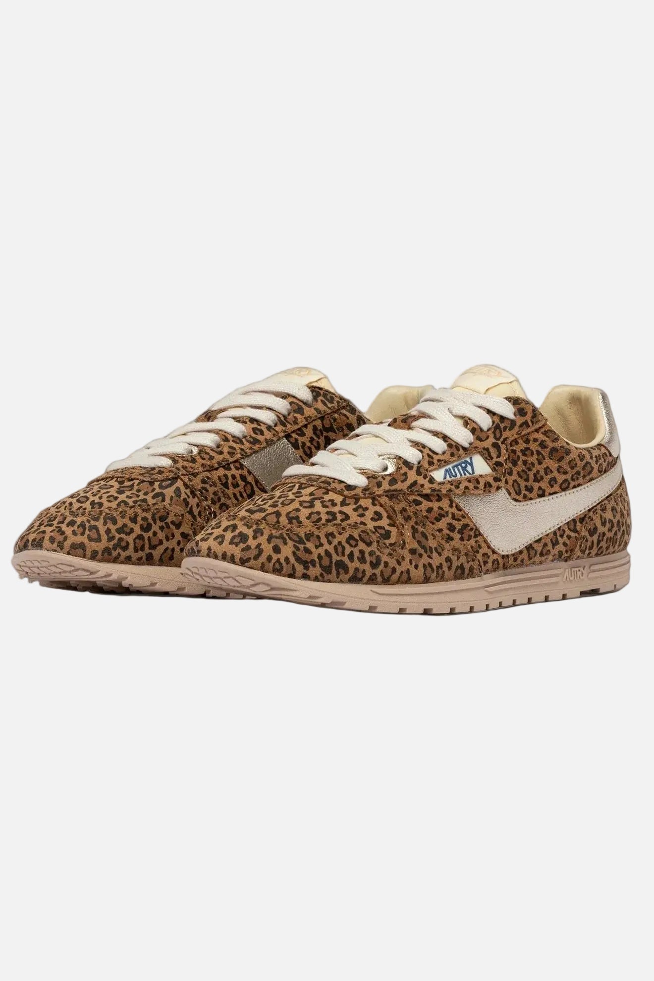 Pair of leopard print sneakers with a white swoosh logo on a white background