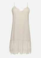 Beige slip dress on a white background