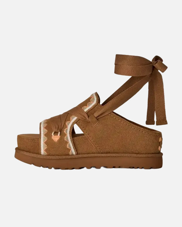 Brown sandal with ankle strap on a white background